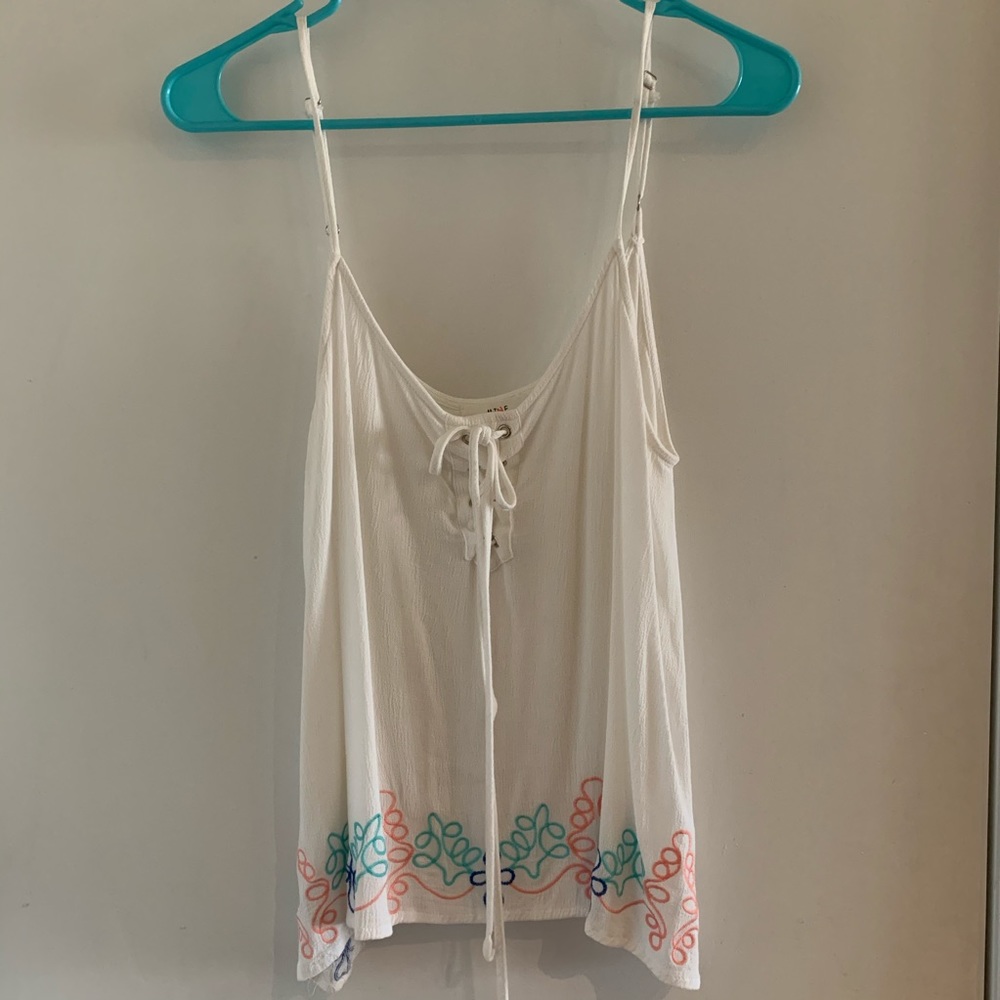 White tank with floral at the bottom